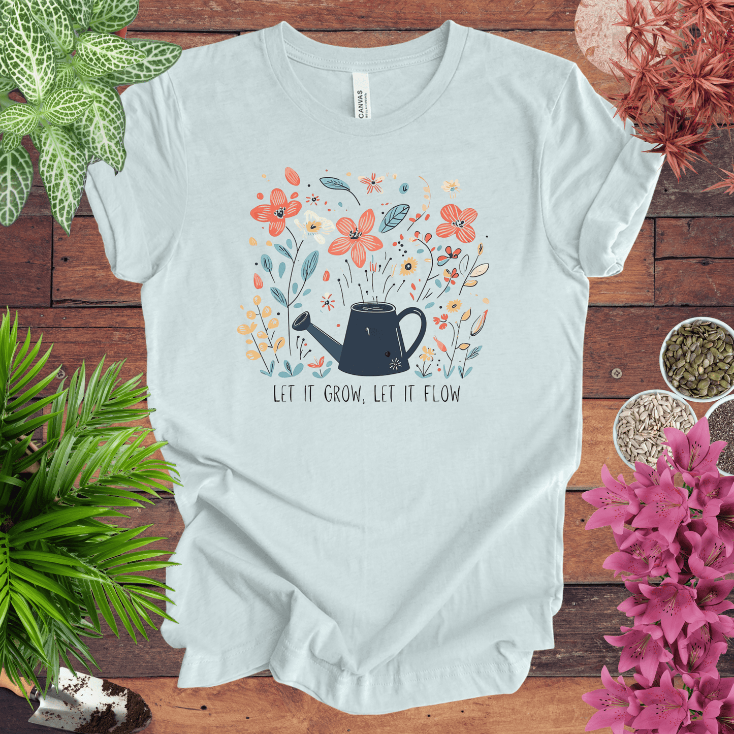 Printify T-Shirt Heather Ice Blue / S Whimsical Watering Can and Flowers T-Shirt