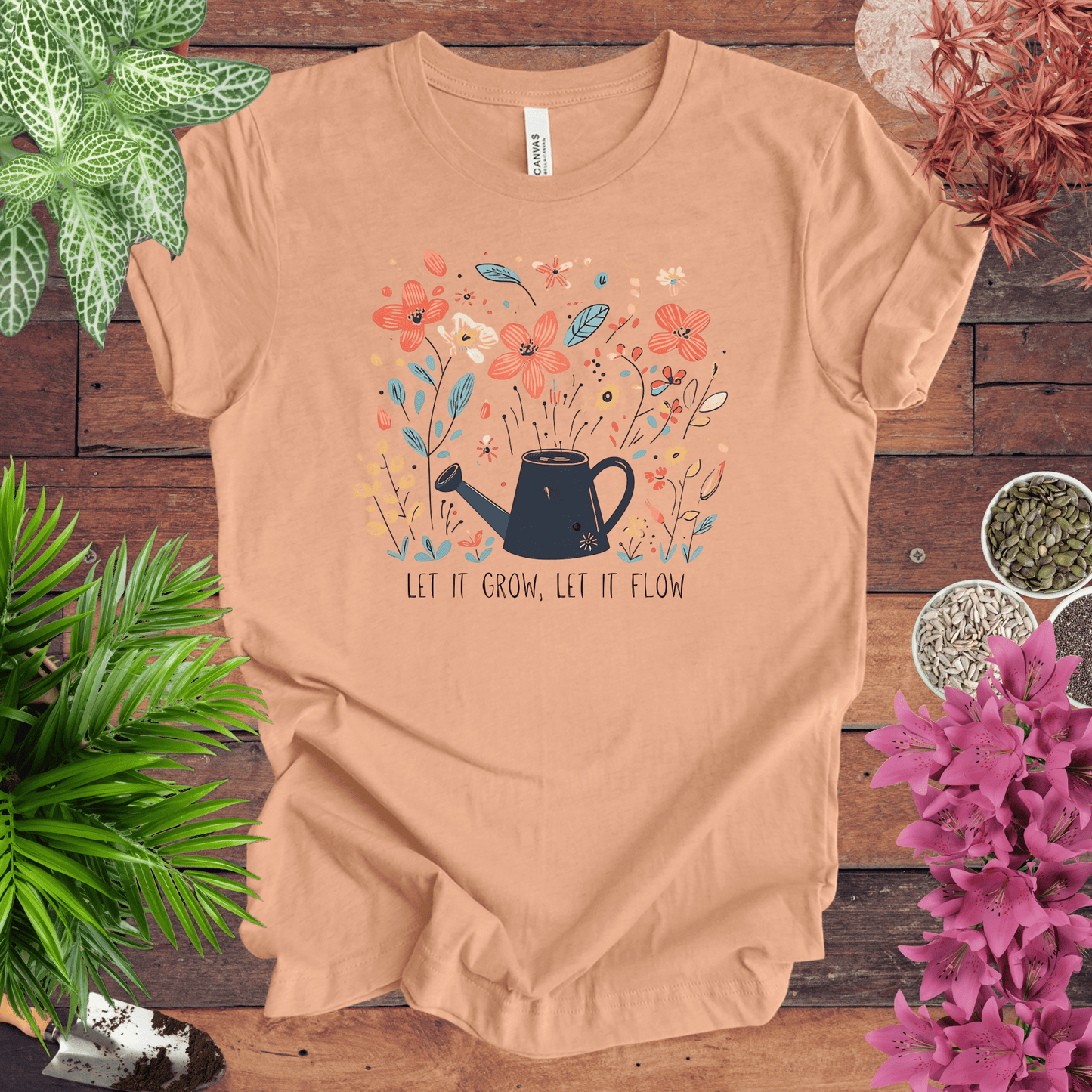 Printify T-Shirt Heather Peach / S Whimsical Watering Can and Flowers T-Shirt