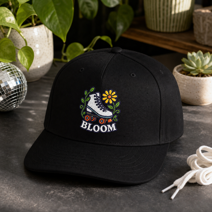 Bloom Roller Skate embroidered hat in Black on a modern plant shelf