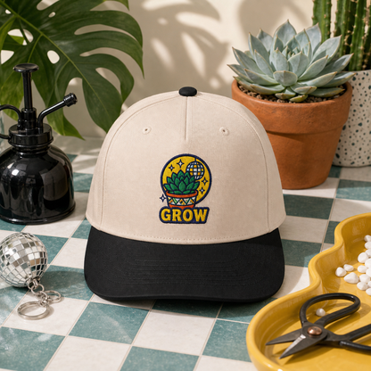 Grow Succulent embroidered hat in Black / Natural on a tiled plant counter