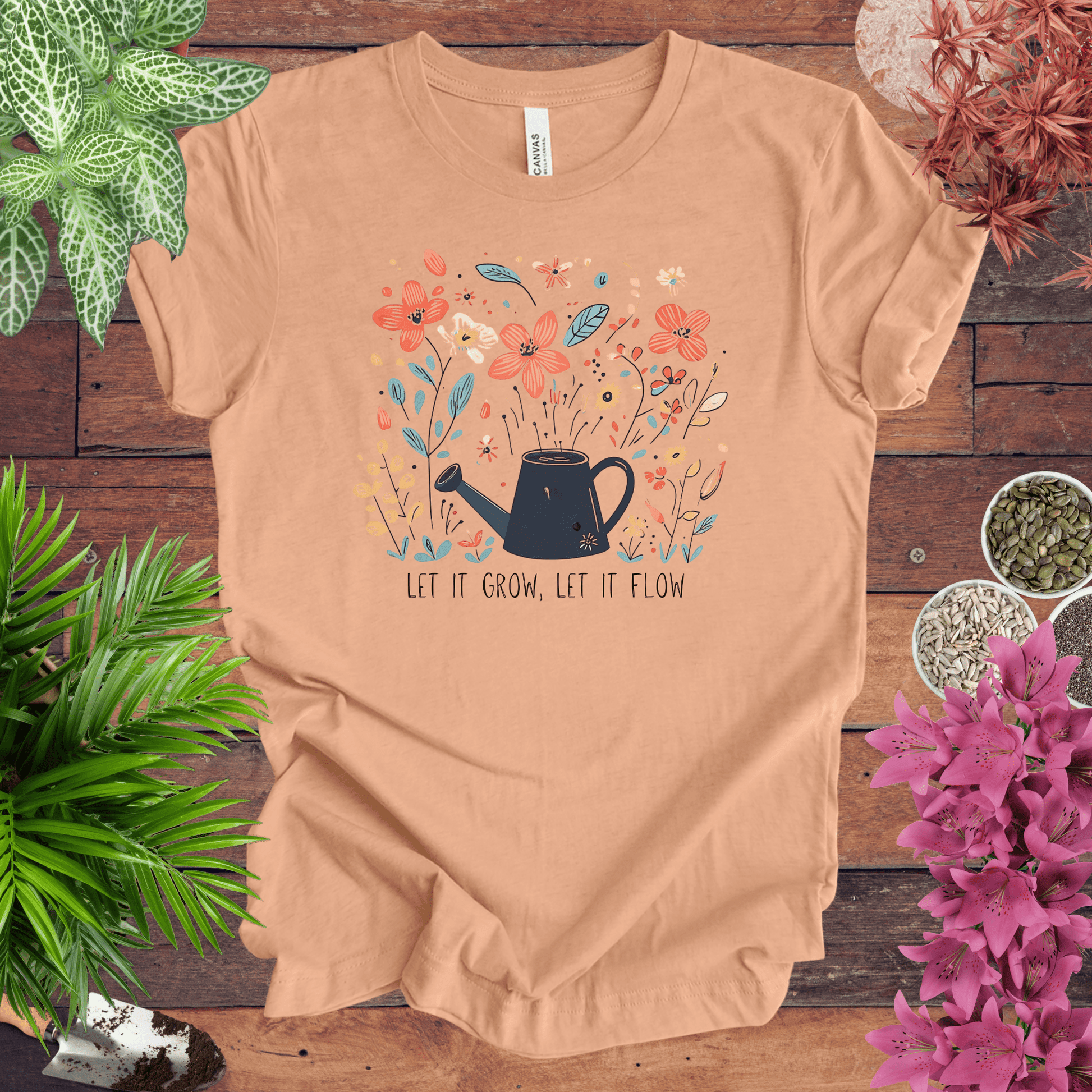 Printify T-Shirt Heather Peach / S Whimsical Watering Can and Flowers T-Shirt